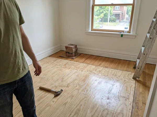 Freshly sealed subfloor ready for new flooring