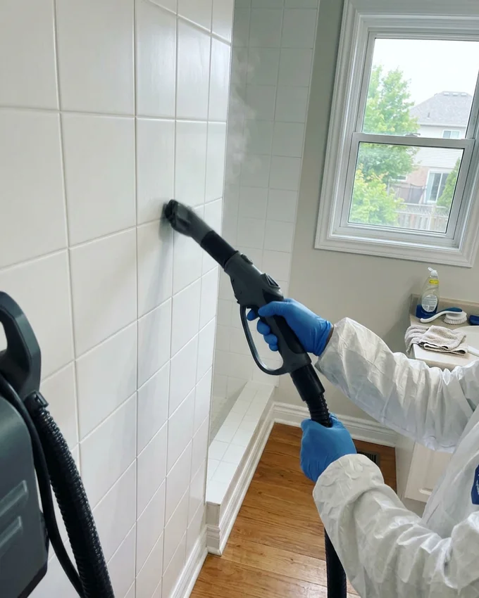 Steam extractor cleaning bathroom tiles